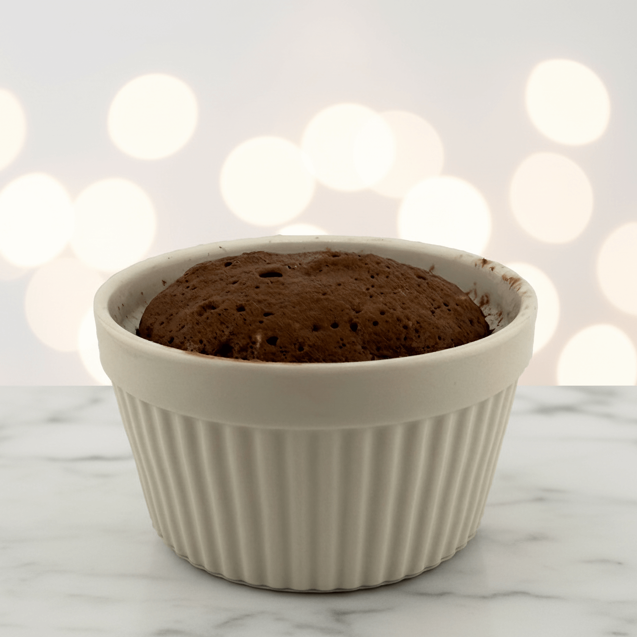 Chocolate Protein Cake Mix baked in a ramekin, showcasing a moist and decadent dessert perfect for a healthy treat.
