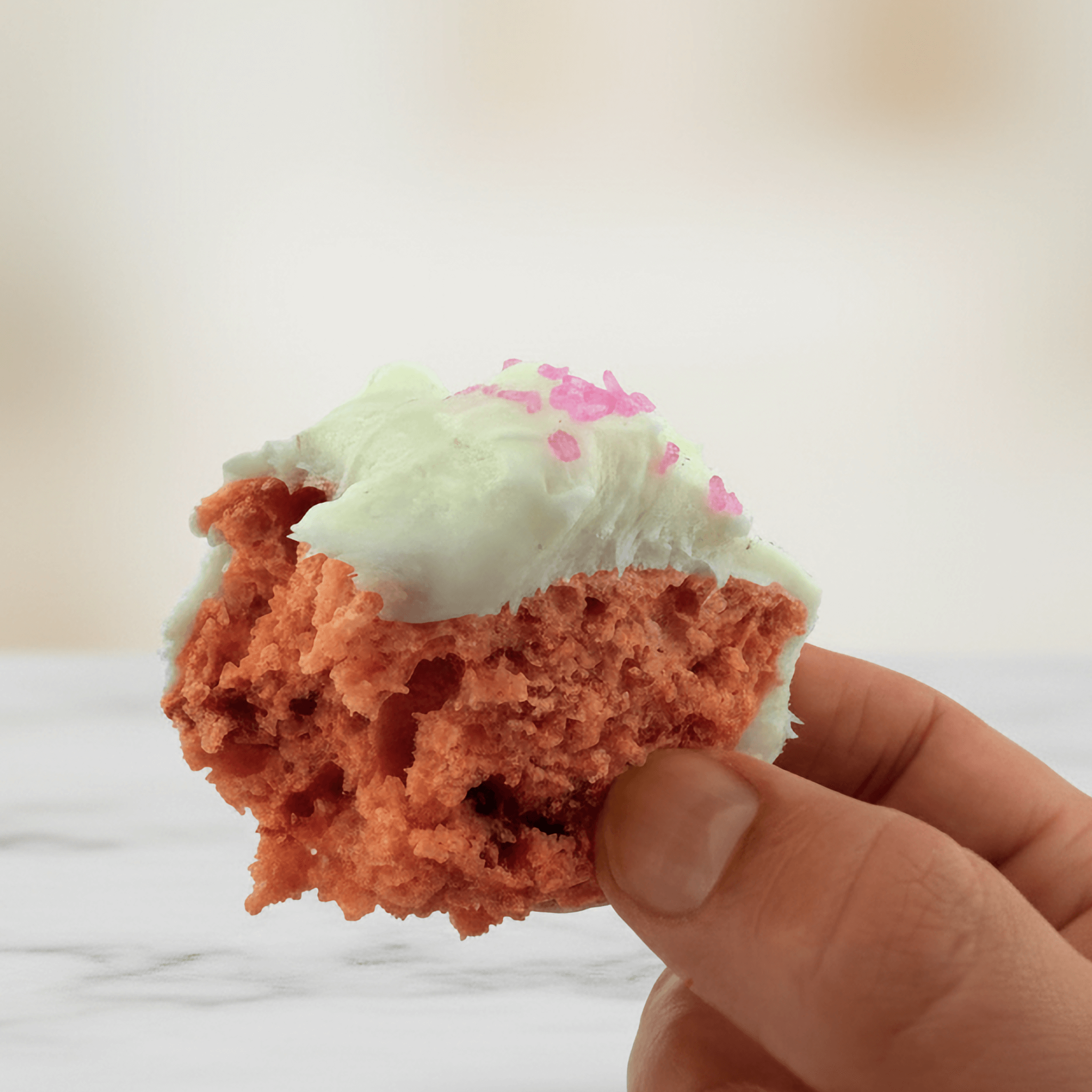 Delicious Strawberry Protein Cake Mix cupcake with frosting and sprinkles, perfect healthy dessert mix.